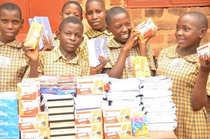 Girls in school uniform with educational materials