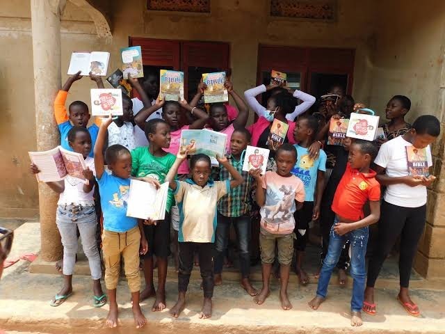 Children and volunteers at a community activity
