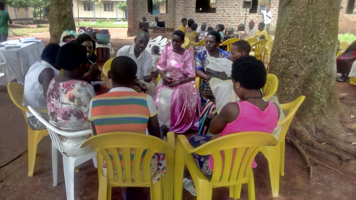 Community members seated in a circle for a discussion