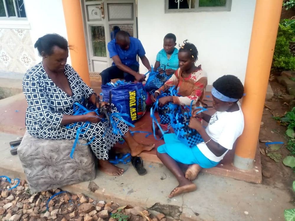 Women and girls going through a distributed kit together